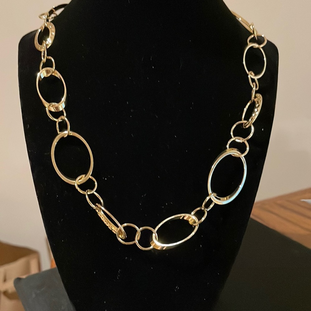15 inches golden color good quality necklace. Great for a gift. Very chic.